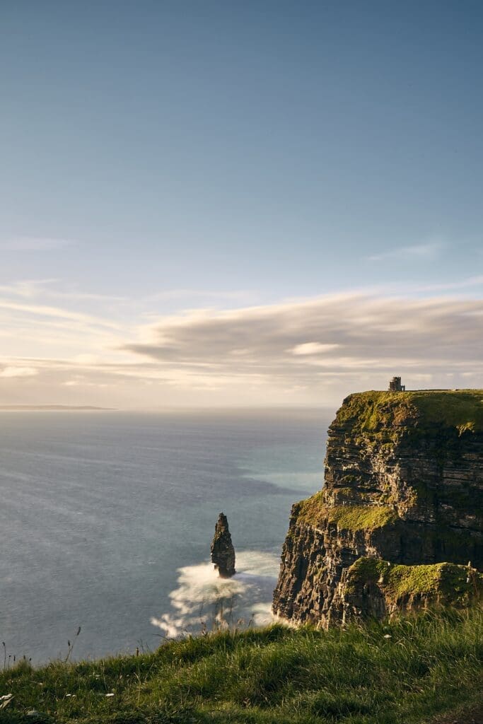 - Vertical shot of Cliffs of Moher Lislorkan Ireland on a cloudy day